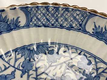 A ribbed Dutch Delft blue and white chinoiserie 'dragon' dish, 18th C.